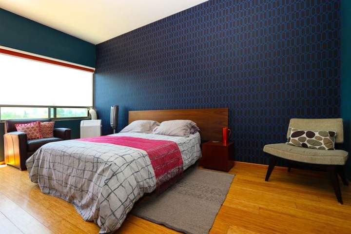 The main bedroom, with a king bed and A/C