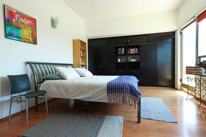 The second bedroom, with a queen bed and A/C